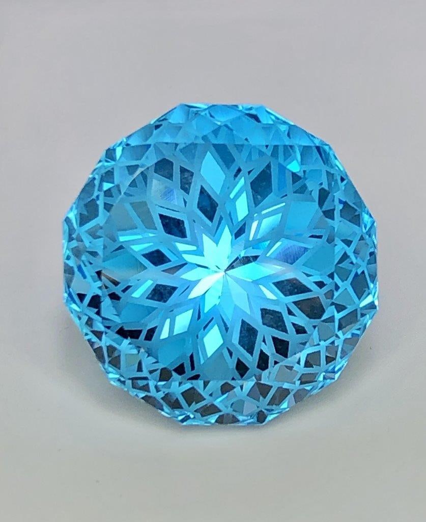 52.25 Carats Swiss Blue Topaz Perfect Flower Cut Gemstone - 22X22X15.5 mm: 52.25 Carats Swiss Blue Topaz Perfect Flower Cut Gemstone - 22X22X15.5 mmShipping Rate: $15.00 .shipping rates are determined by Parcel weight and destination.Combined shipping: We offer combine shipp
