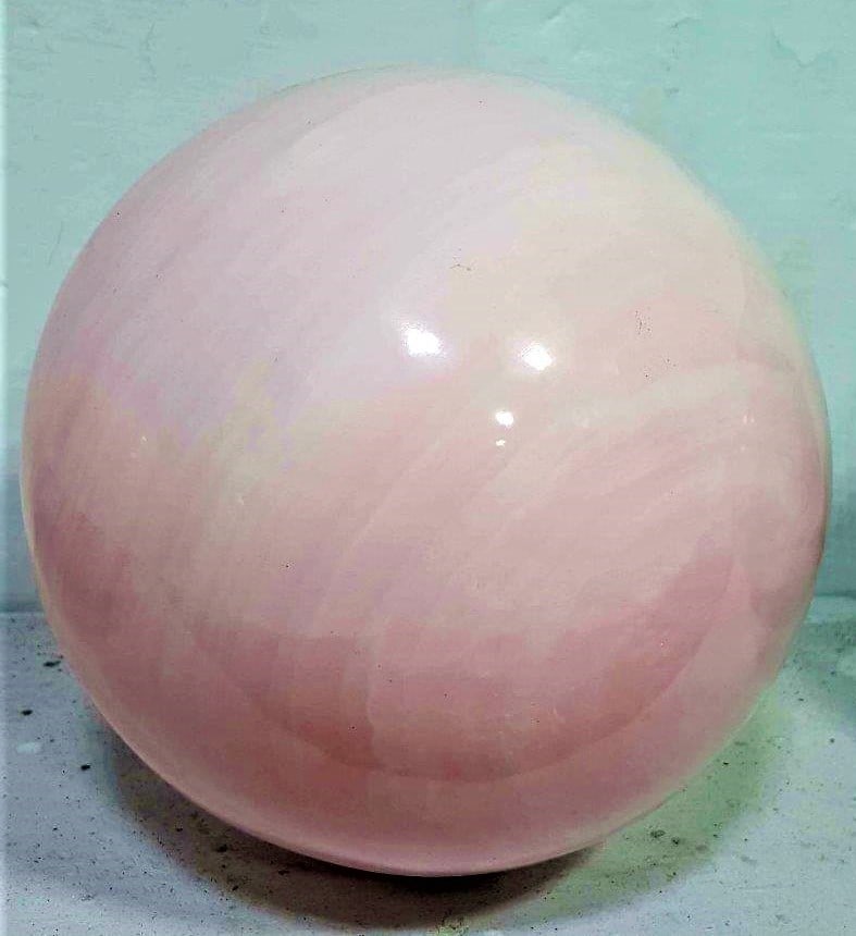 Huge 7.8 kg Baby Pink Mangano Calcite Sphere: Huge Baby Pink Mangano Calcite Sphere - 7.8 kg Baby Pink Mangano Calcite SphereShipping Rate: $160.00 .shipping rates are determined by Parcel weight and destination.Combined shipping: We offer combin