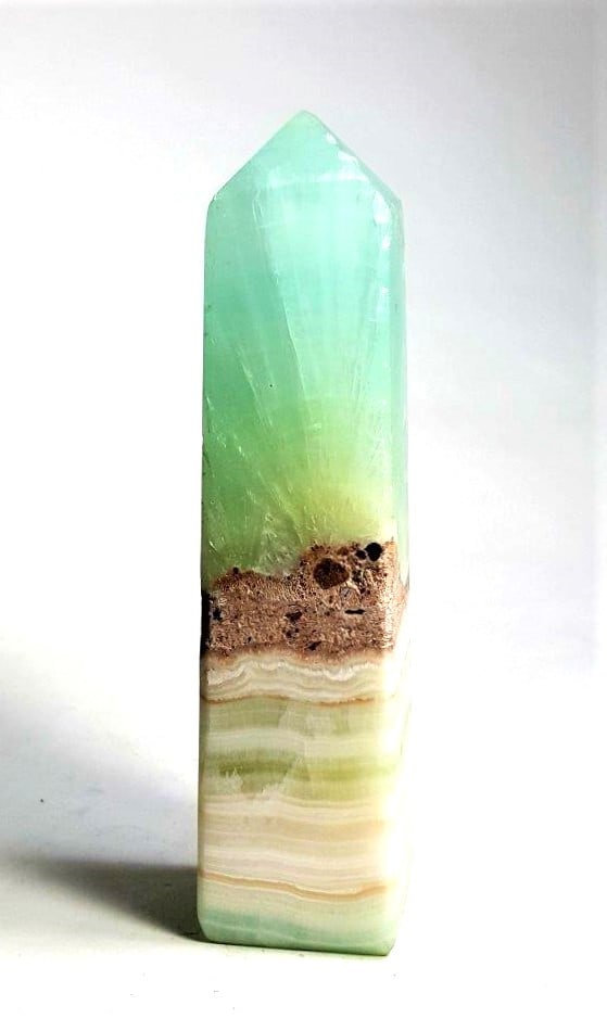 AAA Quality Pistachio Calcite Tower - 386 Grams: AAA Quality Pistachio Calcite Tower - 386 Grams - 142X35X33 mmShipping Rate: $45.00 .shipping rates are determined by Parcel weight and destination.Combined shipping: We offer combine shipping on mult
