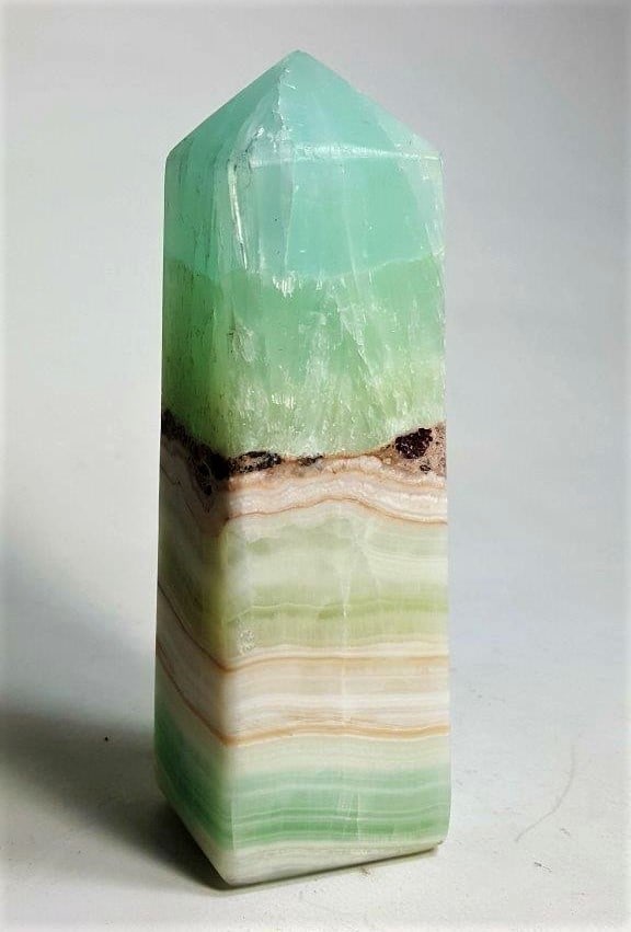 Pistachio Calcite Obelisk - 361 Grams: Pistachio Calcite Obelisk - 361 Grams - 120X37X33 mmShipping Rate: $45.00 .shipping rates are determined by Parcel weight and destination.Combined shipping: We offer combine shipping on multiple items