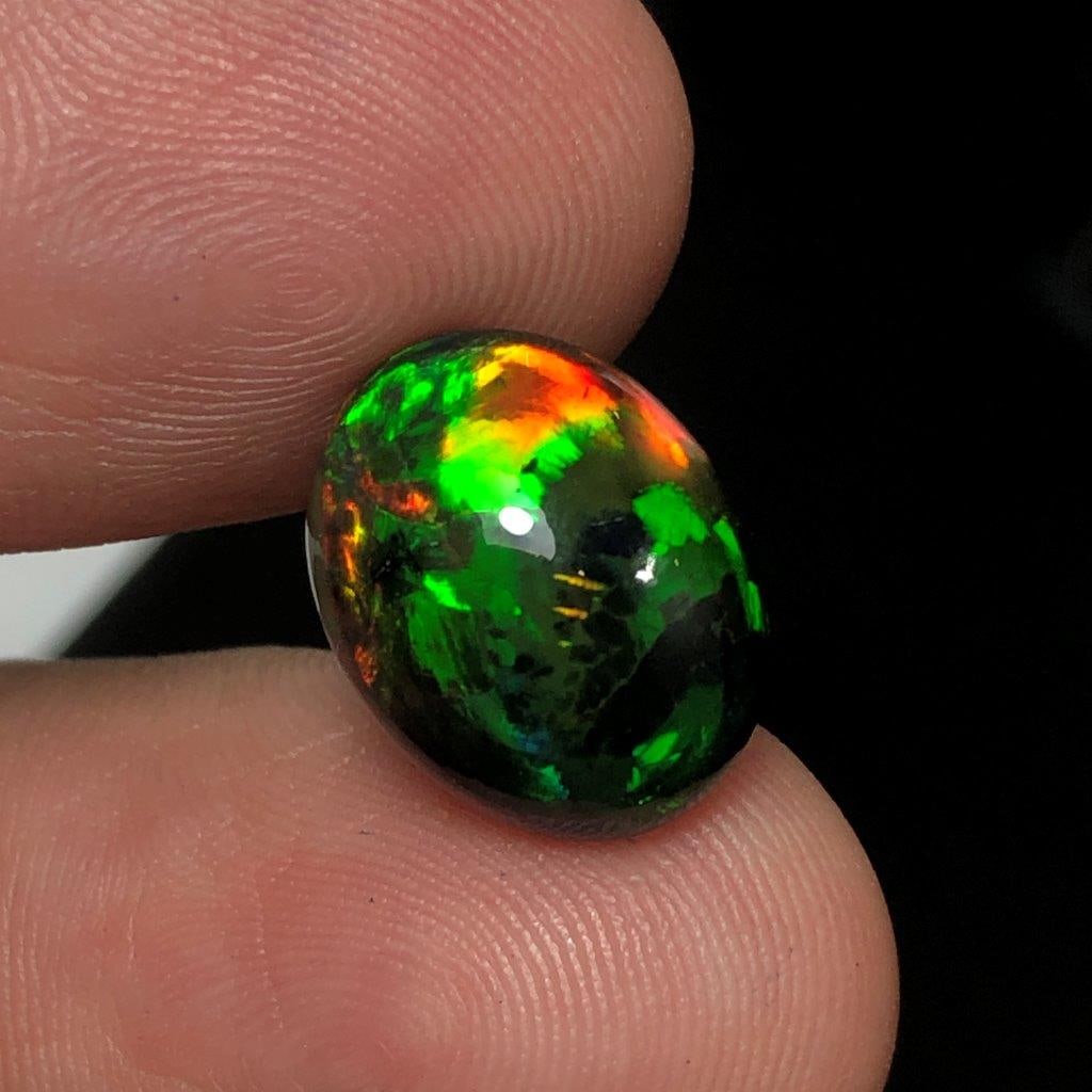4.90 Carats Natural Black Fire Opal Loose Stone ? Vibrant Flashing Colors - 14X11X7.5 mm: 4.90 Carats Natural Black Fire Opal Loose Stone ? Vibrant Flashing Colors - 14X11X7.5 mmShipping Rate: 23$ WorldWideshipping rates are determined by Parcel weight and destination.Combined shipping: We