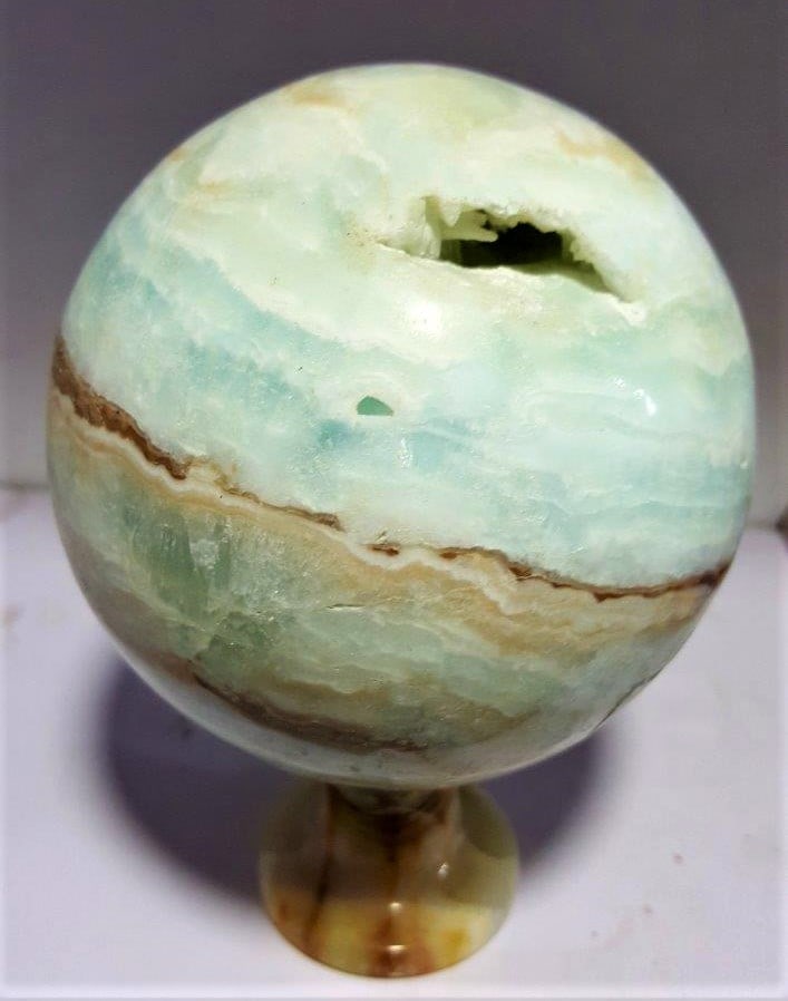 1500 Grams Carrabian Calcite Sphere: 1500 Grams Carrabian Calcite SphereShipping Rate: $90.00 .shipping rates are determined by Parcel weight and destination.Combined shipping: We offer combine shipping on multiple items purchased to red
