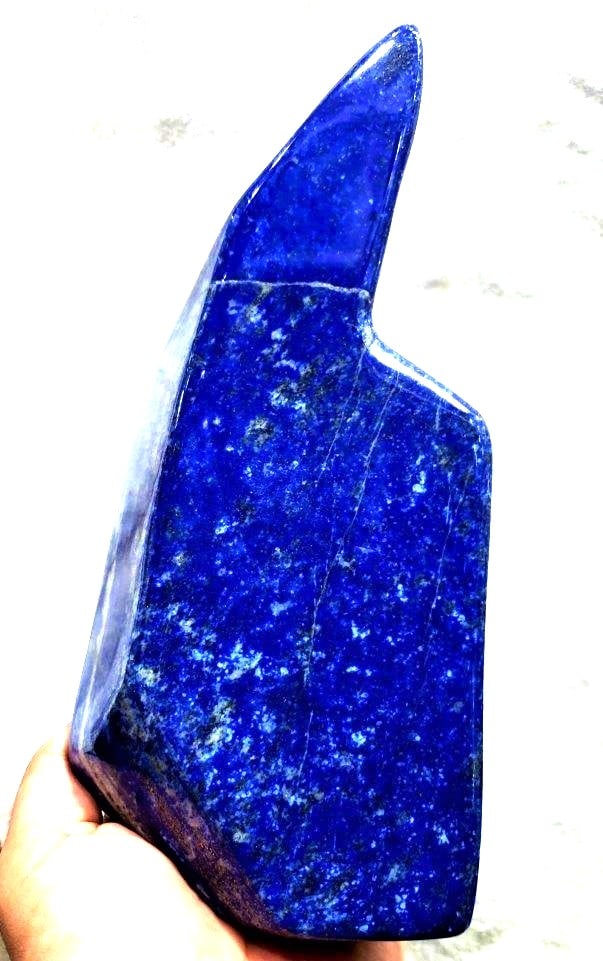 Royal Blue Lapis Lazuli Polished Tumble 1.240 kg: Royal Blue Lapis Lazuli Polished Tumble , Lapis Freeform Self Standing Tumbles - 1.240 kg 112X84X53 mmShipping Rate: $85.00 .shipping rates are determined by Parcel weight and destination.Combined shi