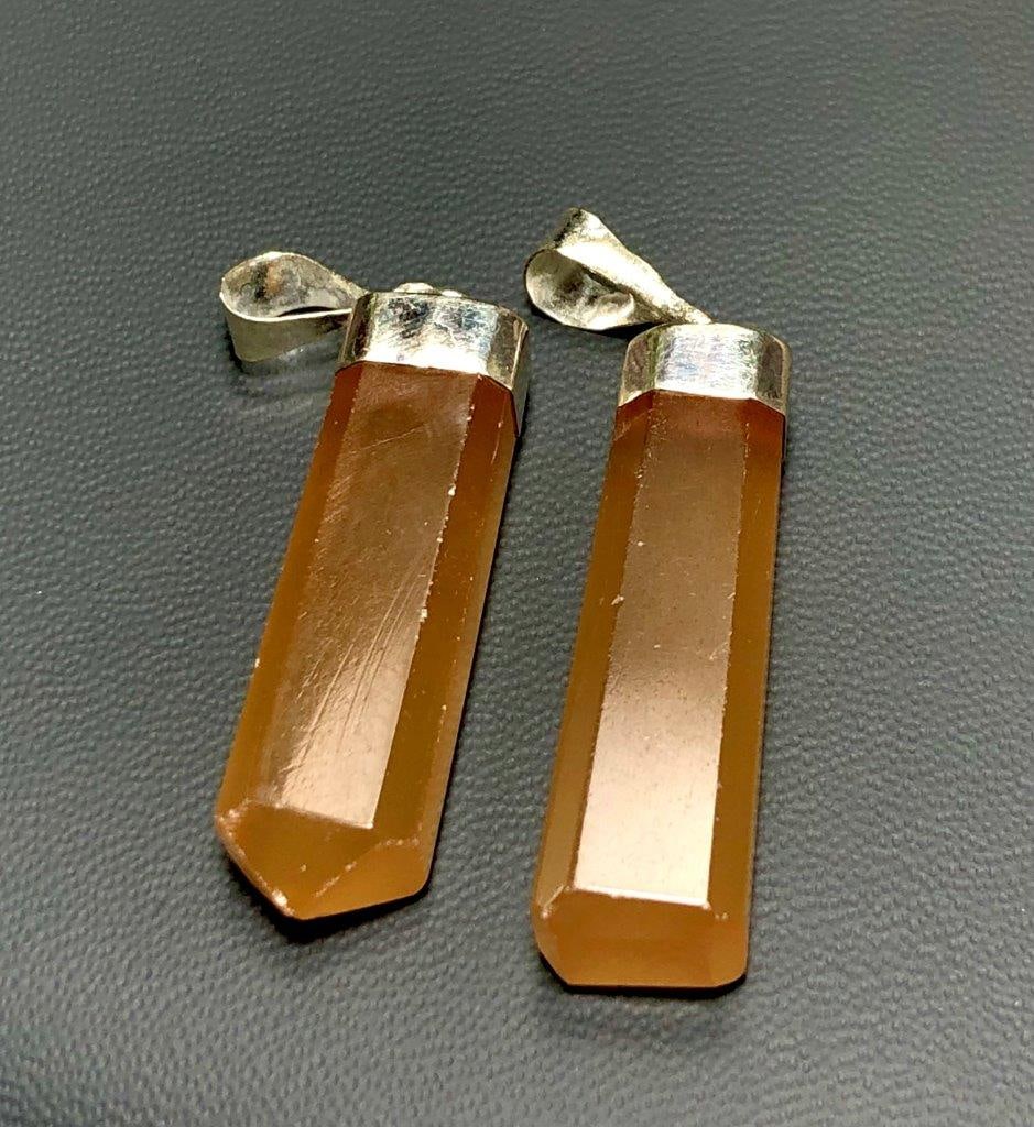 Honey Calcite Pendants in Silver: Honey Calcite Pendants in SilverShipping Rate: $23.00 .shipping rates are determined by Parcel weight and destination.Combined shipping: We offer combine shipping on multiple items purchased to reduce