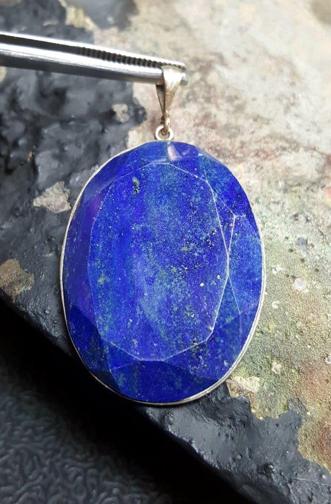 Lapis Lazuli Stone Pendant: Lapis Lazuli Stone Pendant - 45X32X6 mmShipping Rate: $23.00 .shipping rates are determined by Parcel weight and destination.Combined shipping: We offer combine shipping on multiple items purchased to