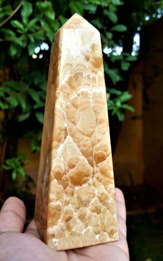 Natural Honey Calcite Tower - 650 Grams: Natural Honey Calcite Tower - 650 Grams - 155X53X52Shipping Rate: $60.00 .shipping rates are determined by Parcel weight and destination.Combined shipping: We offer combine shipping on multiple items 