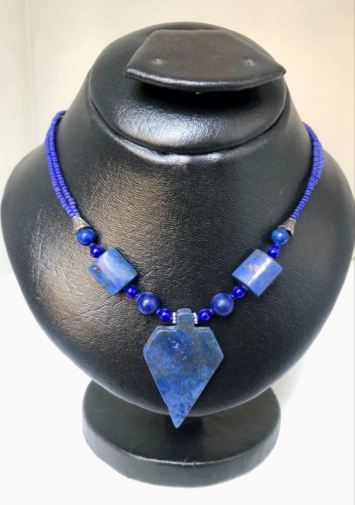 Lapis Lazuli Necklace Natural Blue Gemstone Vintage Estate Jewelry: an elegant hand carved lapis lazuli necklace showcasing the rich royal blue coloration for which this gemstone is prized. The stone displays natural variations and may show subtle pyrite inclusions, a