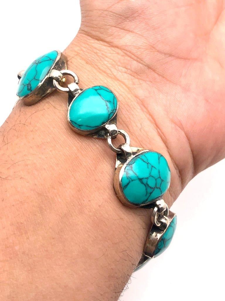Chinese Turquoise Bangle Bracelet Natural Stone Accents ? Vintage Ethnic Jewelry: Offered is a striking Chinese turquoise and brass bangle bracelet accented with round natural turquoise stones. The vibrant cabochons display characteristic matrix veining and tonal variation, ranging