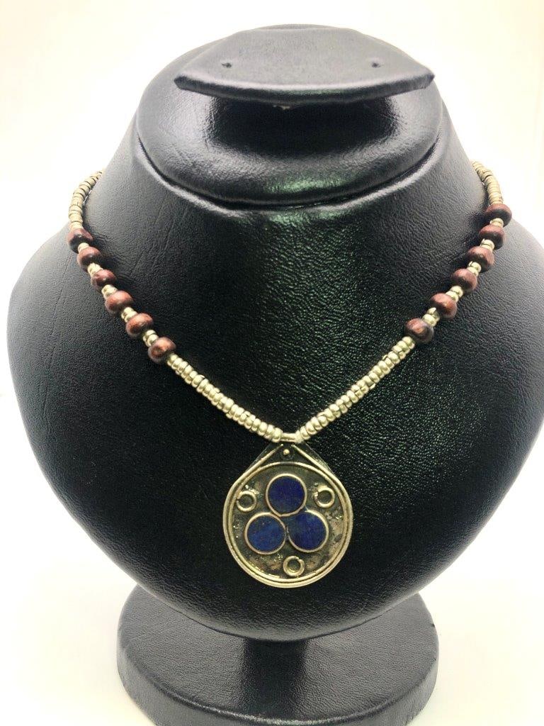 Lapis Lazuli brass Jewelry Natural Blue Gemstone Vintage Estate Jewelry: an elegant hand carved lapis lazuli necklace showcasing the rich royal blue coloration for which this gemstone is prized. The stone displays natural variations and may show subtle pyrite inclusions, a