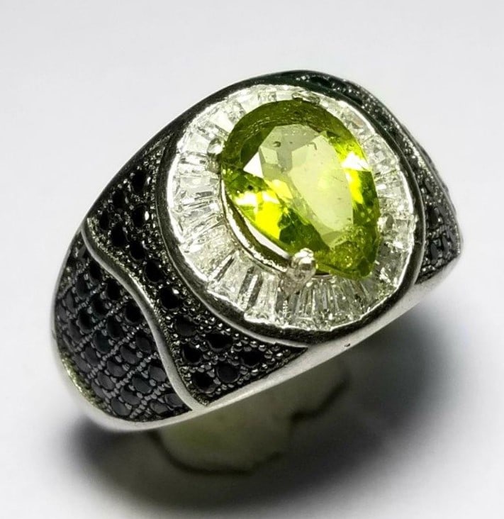 Pear Shape Natural Peridot with Zircons: Pear Shape Natural Peridot with Zircons - Sterling Silver Ladies Ring FREE SHIPPING Shipping rates are determined by Parcel weight and destination.