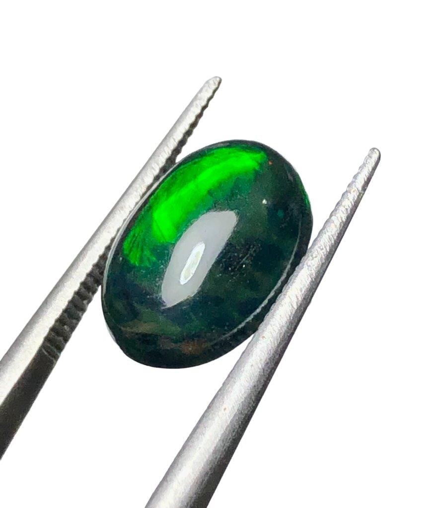 Black Fire Opal - 1.95 Carats - 12X8X4 mm: Black Fire Opal - 1.95 Carats - 12X8X4 mmShipping Rate: $15.00 .shipping rates are determined by Parcel weight and destination.Combined shipping: We offer combine shipping on multiple items purchased 