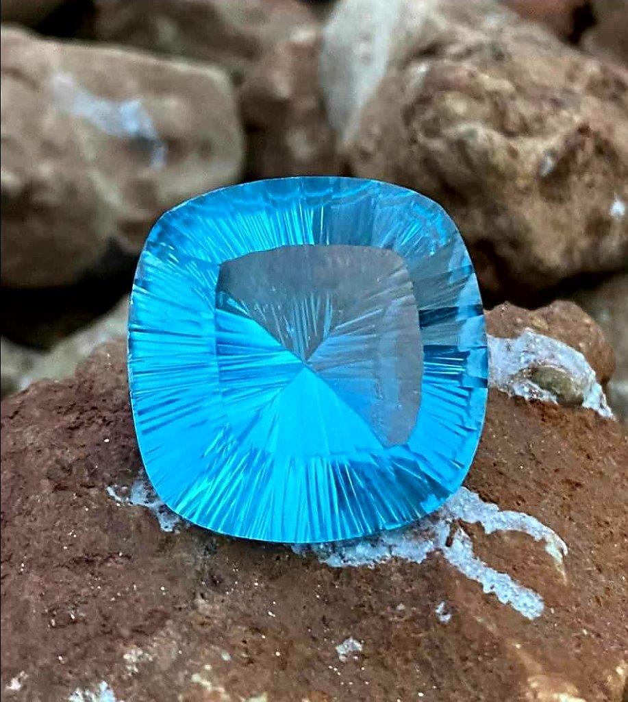 Cushion Cut Laser Blue Topaz - 60.85 Carats - 25X25X14 mm: Cushion Cut Laser Blue Topaz - 60.85 Carats - 25X25X14 mmShipping Rate: $15.00 .shipping rates are determined by Parcel weight and destination.Combined shipping: We offer combine shipping on multiple 