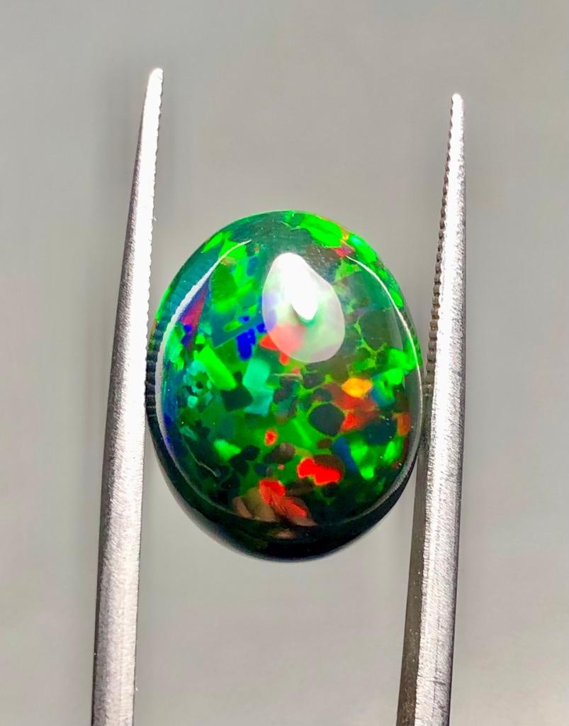 8.35 Carats AAA Quality Natural Black Opal From Ethopia - 16X13X9 mm: 8.35 Carats AAA Quality Natural Black Opal From Ethopia - 16X13X9 mmShipping Rate: $15.00 .shipping rates are determined by Parcel weight and destination.Combined shipping: We offer combine shipping o