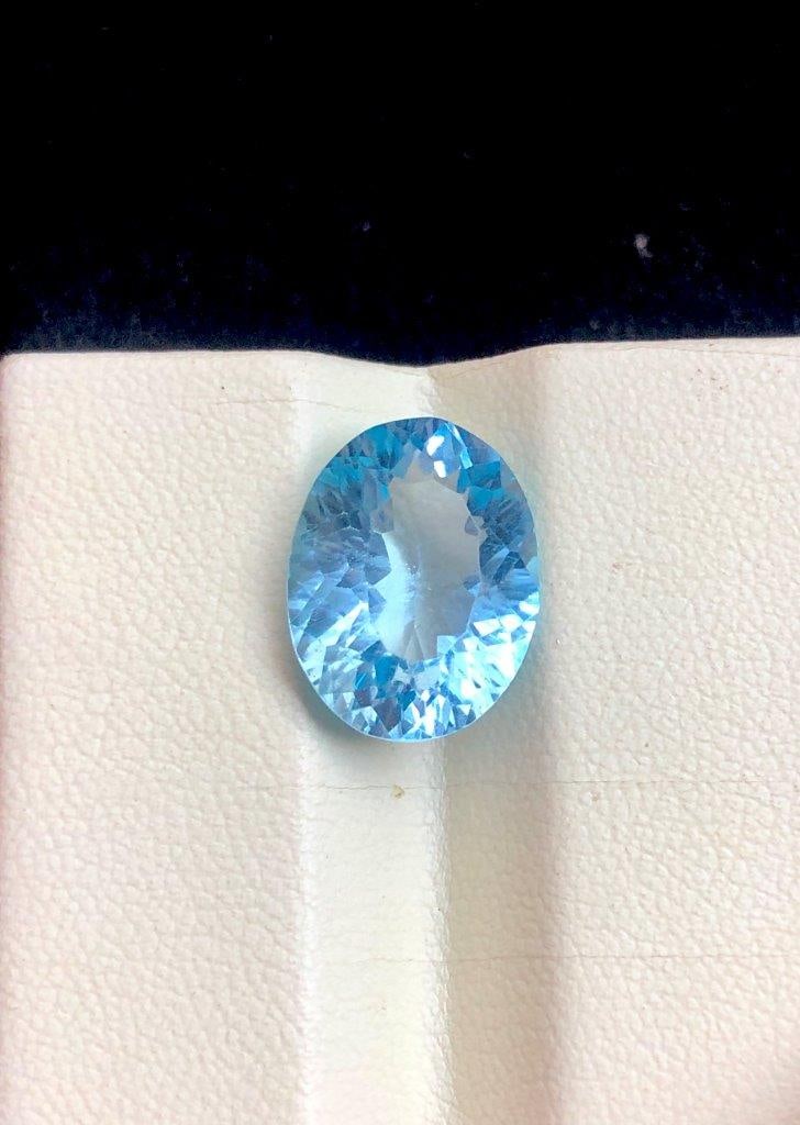 10.25 Carats AAA Swiss Blue Topaz Loose Gemstone Laser Cut | Premium Sky Blue Gem 15x11x8 mm: Discover this stunning 10.25 carat AAA Quality Swiss Blue Topaz loose gemstone, featuring a precision laser cut designed to maximize brilliance and light reflection. Measuring 15 ? 11 ? 8 mm, this bea