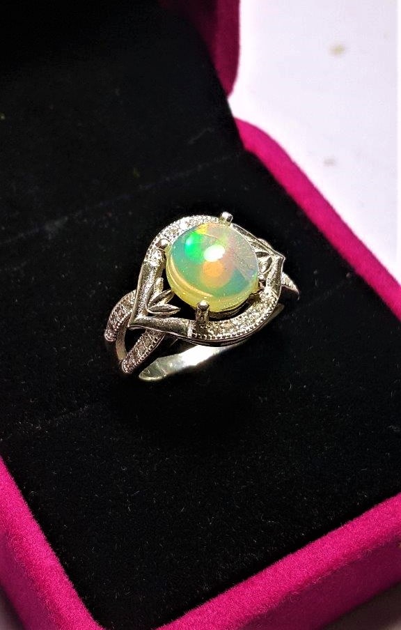 Fire Opal Engagement Ring in sterling silver: Fire Opal Engagement Ring in sterling silverShipping Rate: $23.00 .shipping rates are determined by Parcel weight and destination.Combined shipping: We offer combine shipping on multiple items purchas