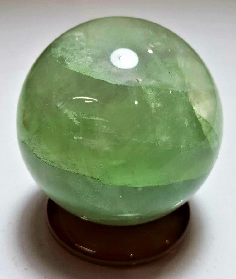 Polished Fluorite Sphere - 917 Grams: Polished Fluorite Sphere - 917 Grams - Diameter 81 mmShipping Rate: $75.00 .shipping rates are determined by Parcel weight and destination.Combined shipping: We offer combine shipping on multiple item