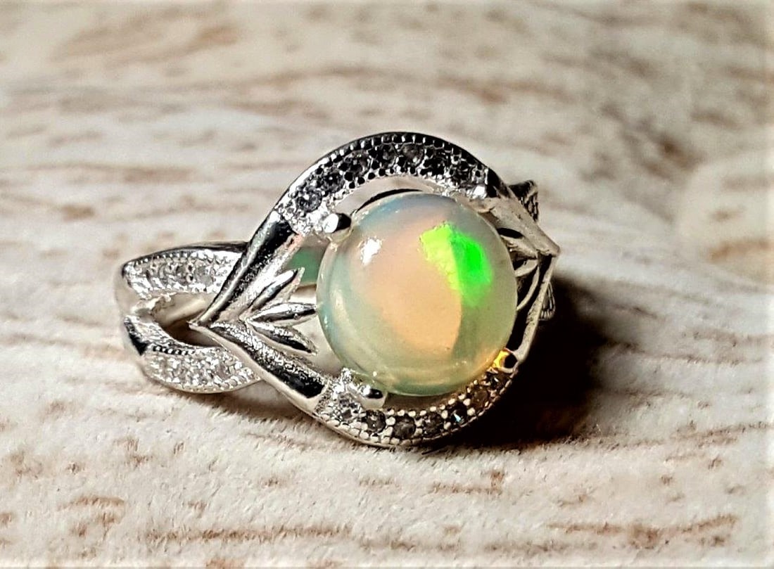 Fire White Opal in Sterling Silver Ring: Fire White Opal in Sterling Silver Ring Fashion JewelryShipping Rate: $23.00.shipping rates are determined by Parcel weight and destination.Combined shipping: We offer combine shipping on multiple ite