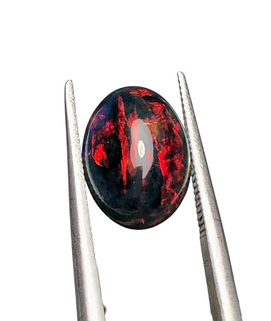 1.70 Carats Black Fire Opal - 11X8X5 mm: 1.70 Carats Black Fire Opal - 11X8X5 mmShipping Rate: $15.00 .shipping rates are determined by Parcel weight and destination.Combined shipping: We offer combine shipping on multiple items purchased to
