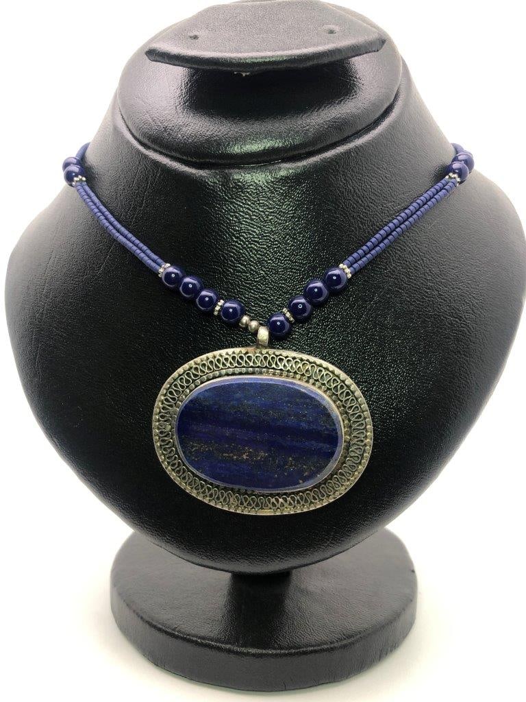 Vintage Hand Carved Lapis Lazuli Necklace: an elegant hand carved lapis lazuli necklace showcasing the rich royal blue coloration for which this gemstone is prized. The stone displays natural variations and may show subtle pyrite inclusions, a