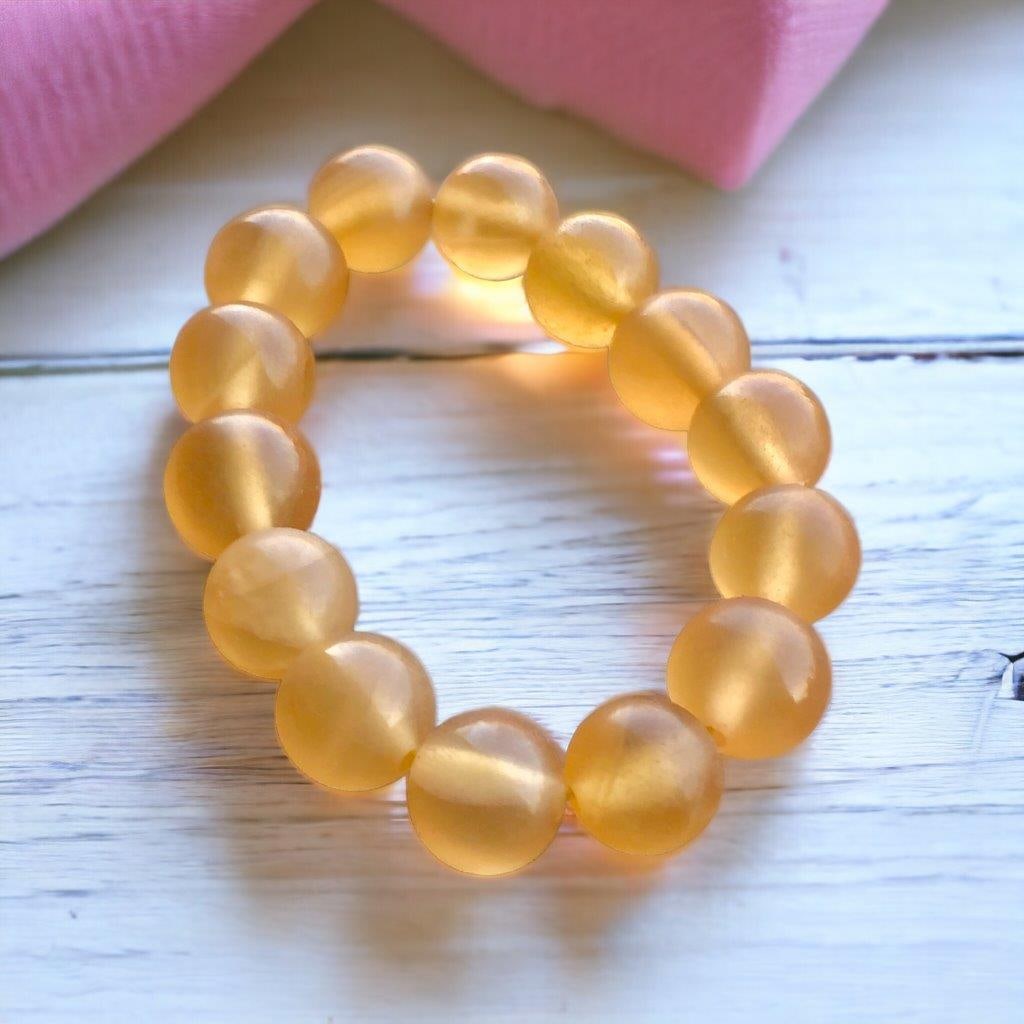 AAA Quality Honey Calcite Beaded Bracelet: AAA Quality Honey Calcite Beaded Bracelet Shipping: Domestic: Flat-rate of 23$ to anywhere within the contiguous U.S.International: Foreign shipping rates are determined by destination. International
