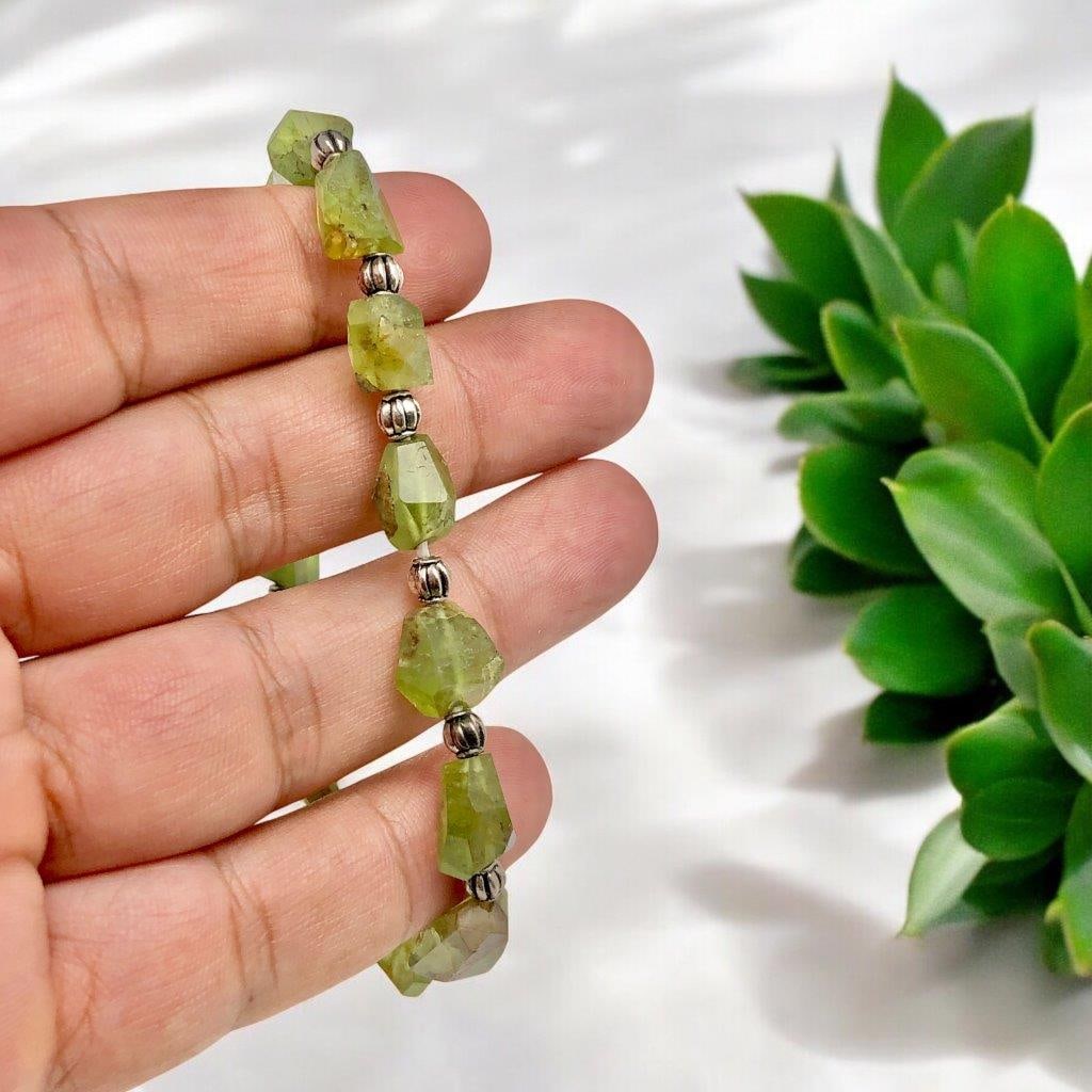 Natural Peridot Hand Carved Beaded Bracelet: Natural Peridot Hand Carved Beaded BraceletShipping Rate: $23.00 .shipping rates are determined by Parcel weight and destination.Combined shipping: We offer combine shipping on multiple items