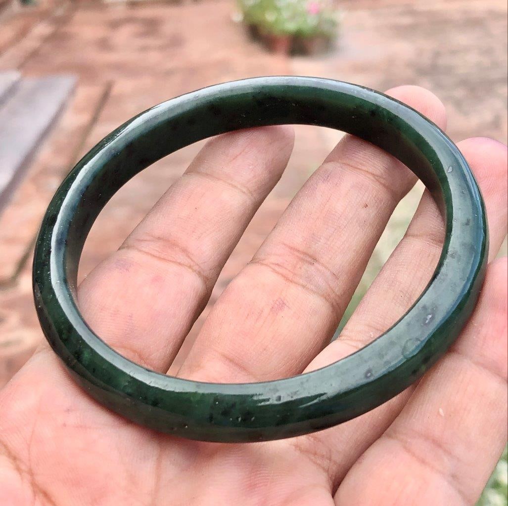 Natural Green Nephrite Jade Bangle Bracelet ? Size 56?65 Classic Gemstone Jewelry: Add timeless elegance to your collection with this Natural Green Nephrite Jade Bangle Bracelet, crafted from genuine jade and polished to a smooth, lustrous finish. Its rich green color reflects the n