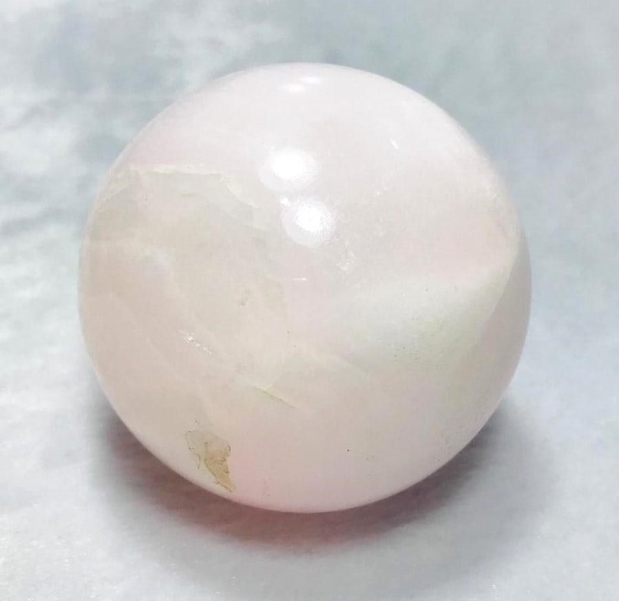 Pinkish Calcite Sphere - 328.2 Grams: Pinkish Calcite Sphere - Diamater 61mm - 328.2 Grams Shipping: $45.00. Shipping rates are determined by Parcel weight and destination.