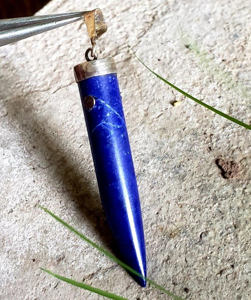 Royal Blue Lapis Pendant: Royal Blue Lapis Pendant - 45X6 mm Shipping: $23.00. Shipping rates are determined by Parcel weight and destination.