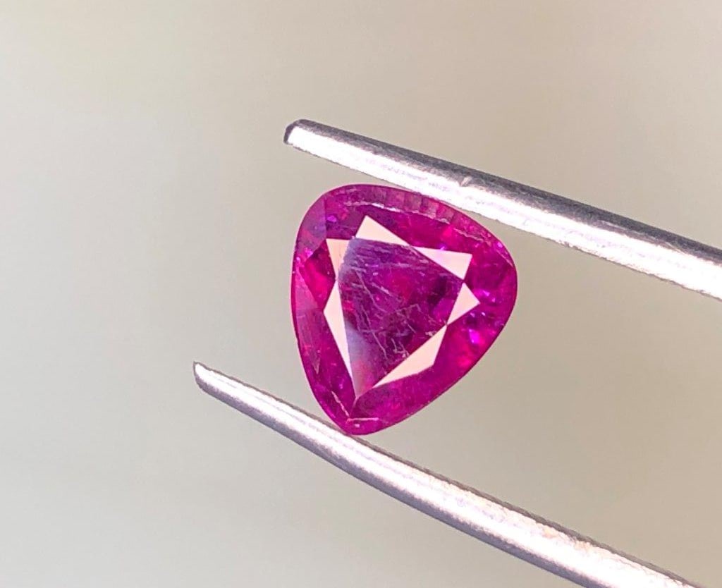 1.45 Carats Purplish Pink Natural Ruby ? Afghanistan Origin, 7?7?4 mm: This listing features a natural purplish pink ruby weighing 1.45 carats, sourced from Afghanistan, a region known for producing high-quality and richly colored gemstones. The ruby displays an attracti