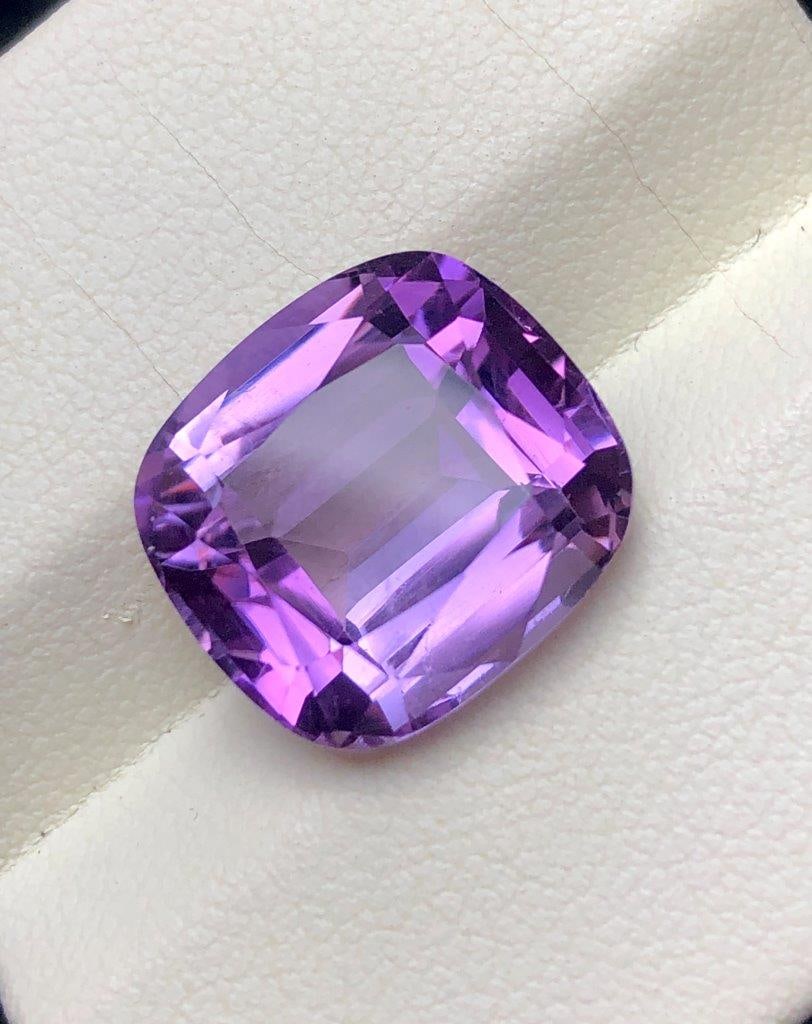 Natural Amethyst Gemstone AAA Quality - 5.60 Cts - 12X11X6 mm: Beautiful 5.60 carats AAA quality natural Amethyst gemstone featuring a rich deep purple color, excellent clarity, and brilliant natural sparkle. Measuring 12x11x6 mm, this finely cut loose crystal is