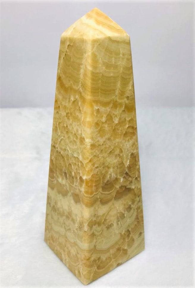 Healing Choclate Calcite point tower - 637.5G: Healing Choclate Calcite point tower - 155X51mm - 637.5G Shipping: $55.00. Shipping rates are determined by Parcel weight and destination.