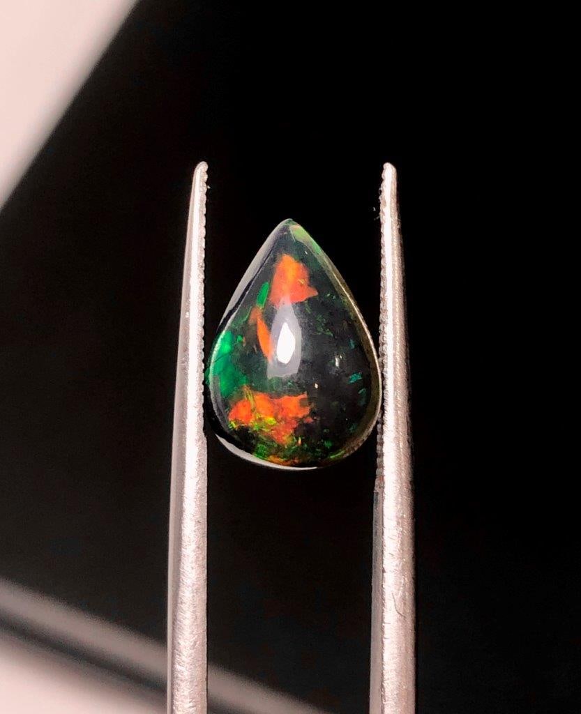 2.10 Carats Natural Black Fire Opal Loose Gemstone - 11X8X6 mm: 2.10 Carats Natural Black Fire Opal Loose Gemstone - 11X8X6 mmShipping Rate: 23$ WorldWideshipping rates are determined by Parcel weight and destination.Combined shipping: We offer combine shipping on