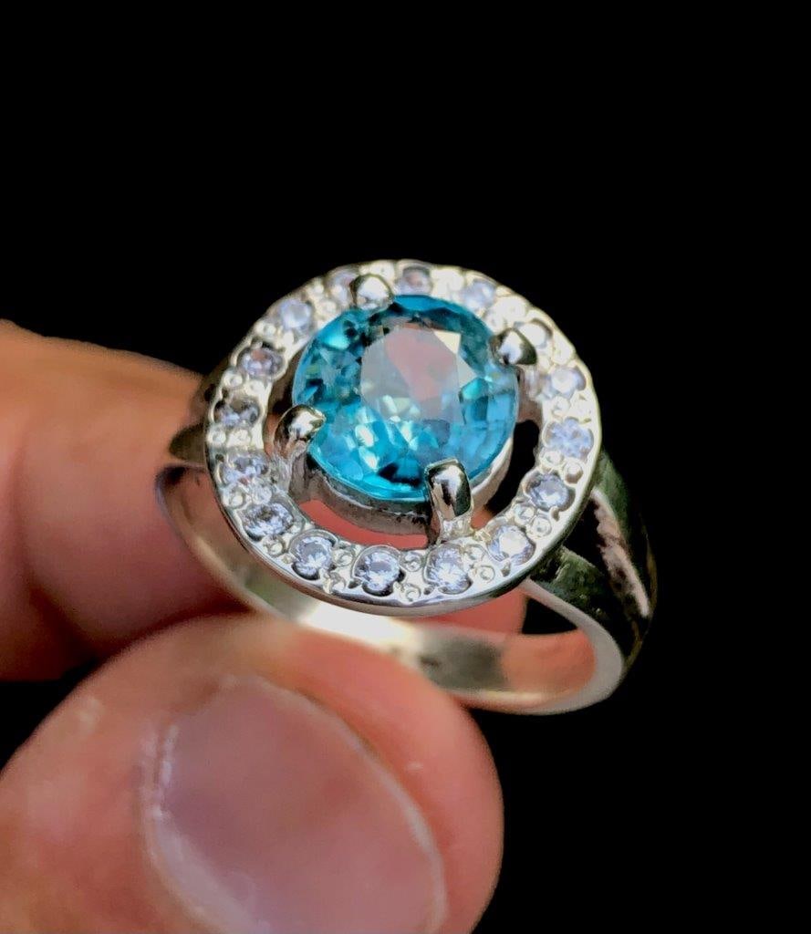 Sterling Silver Blue Zircon Ring: Sterling Silver Blue Zircon RingStone Weight: 3.70 CaratsJewelry Weight: 5.81 GramsRing Size: 8 US (Adjustable)Metal: Silver Choose design of your own and we will make it for youWe accept custom