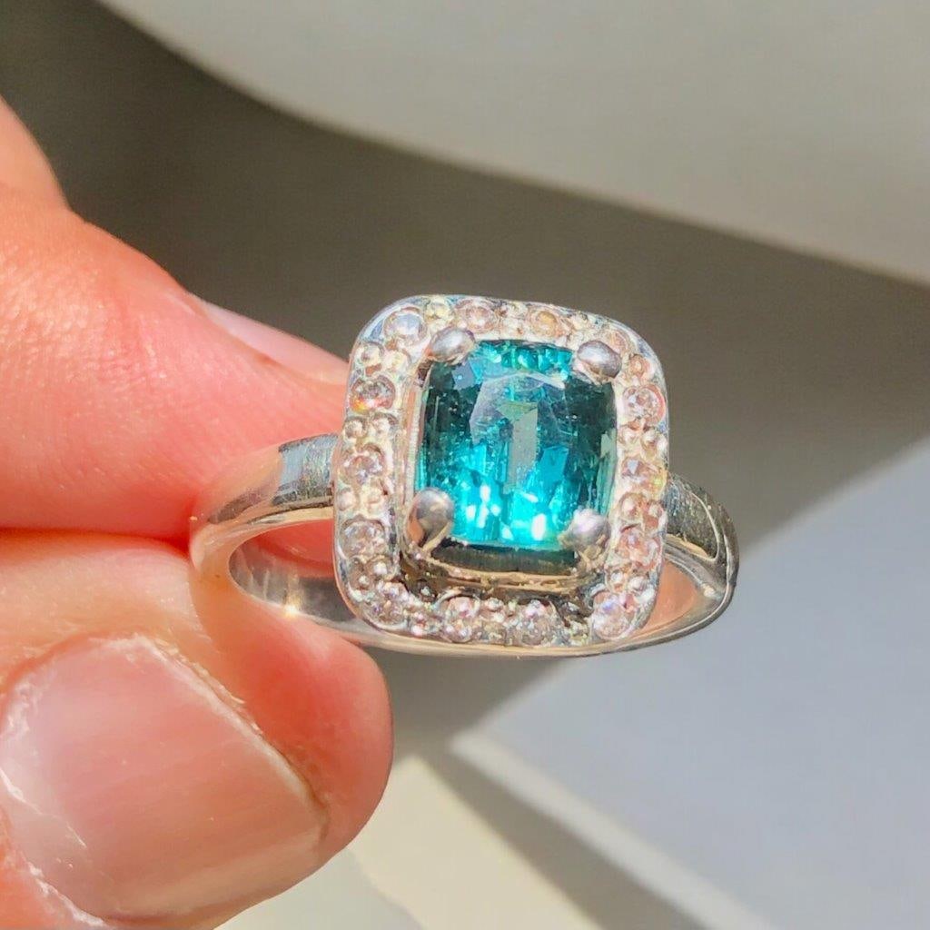 Sterling Silver Indicolite Tourmaline RING With Zircons - RING Size 7.5 US: Sterling Silver Indicolite Tourmaline RING With Zircons - RING Size 7.5 US Ring Size: 7.5 US (Adjustable)Stone Weight: 4 Carats Silver: 4.5 Grams Choose design of your own and we will make it for
