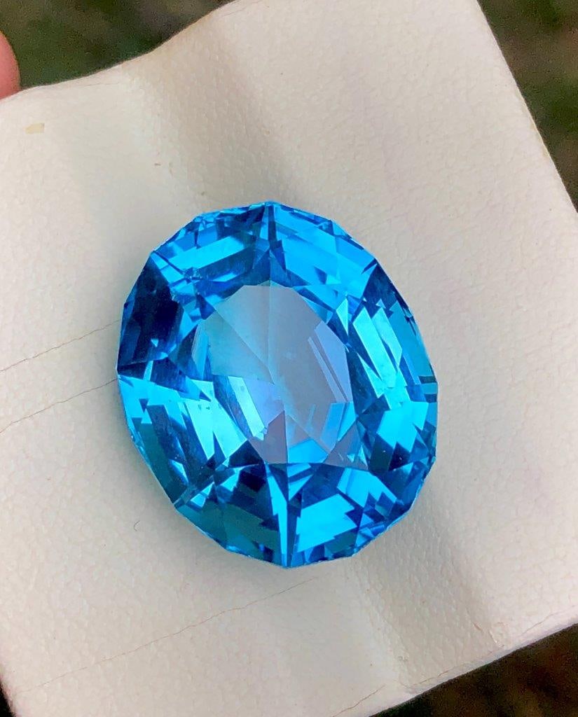 32.40 Carats AAA Swiss Blue Topaz ? Natural Loose Gemstone (21?17?13 mm) ? Brilliant Blue Statement: This exquisite 32.40 carat Swiss Blue Topaz showcases a vivid, eye-catching blue color with AAA-quality clarity and brilliance. Measuring 21 ? 17 ? 13 mm, this large gemstone is expertly cut to