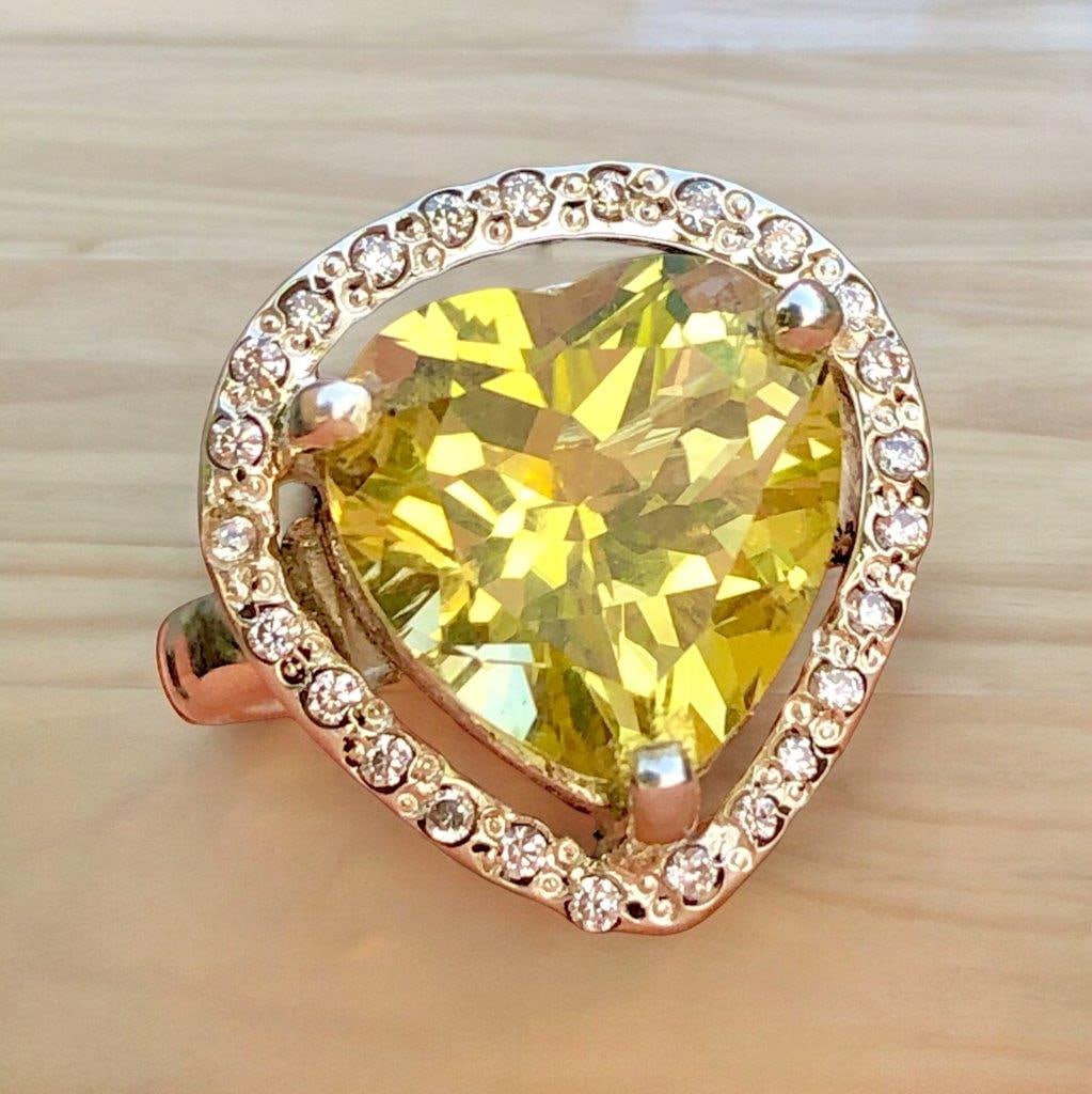 Fiery HEART Citrine Quartz RING in SILVER: Fiery HEART Citrine Quartz RING in SILVER STONE Weight: 22 CaratsRing Size: 8.5 US(Adjustable) Ring Weight: 10.93 Grams Zircons: 60 CentsMetal: Silver Choose design of your own and we will make it for