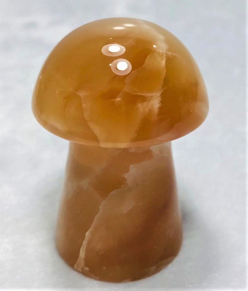 Honey Calcite Mashroom 104.4G: Honey Calcite Mashroom 56X39mm 104.4G Shipping: $23.00. Shipping rates are determined by Parcel weight and destination.