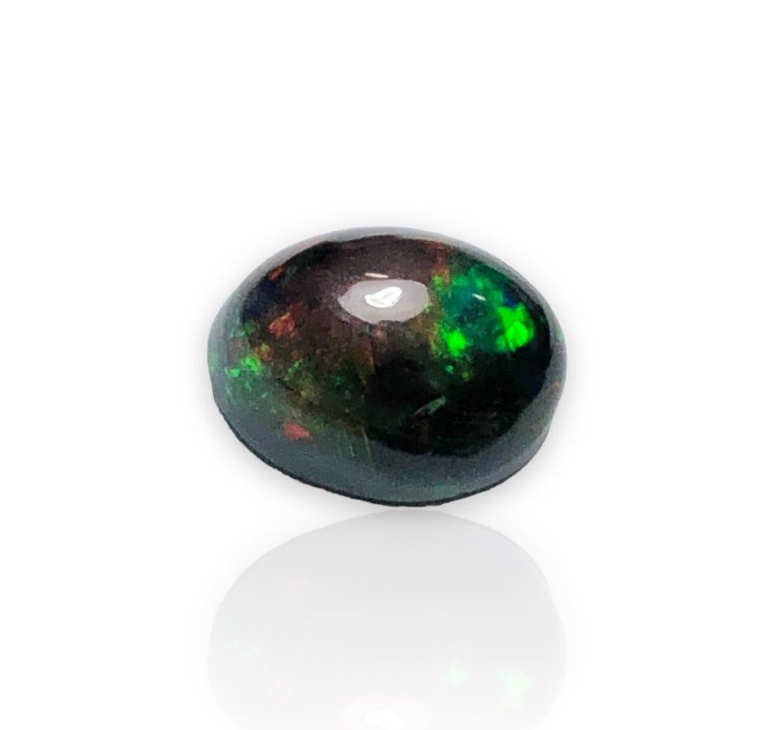 1.70 carats Fine Quality Fire Black Opal - 10X8X5 mm: 1.70 carats Fine Quality Fire Black Opal - 10X8X5 mmShipping Rate: $15.00 .shipping rates are determined by Parcel weight and destination.Combined shipping: We offer combine shipping on multiple items