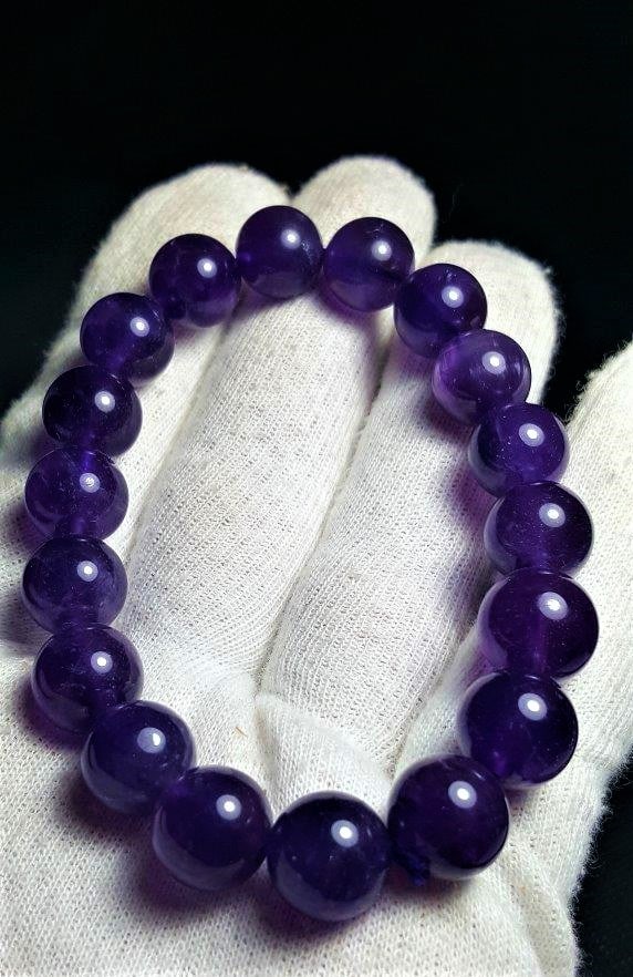 Amethyst Bracelet, High Grade 12 mm Genuine: Amethyst Bracelet, High Grade 12 mm Genuine Gemstone, Unisex Stretch Fit, Crown Chakra Crystal HealingShipping Rate: $23.00 .shipping rates are determined by Parcel weight and destination.Combined