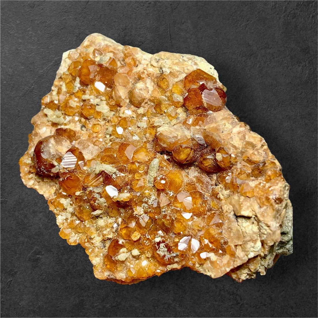 Natural Hessonite Garnet Cluster on Matrix - 99 Grams - 63X46X27 mm: Natural Hessonite Garnet Cluster on Matrix - 99 Grams - 63X46X27 mmShipping Rate: $23.00 .shipping rates are determined by Parcel weight and destination.Combined shipping: We offer combine shipping