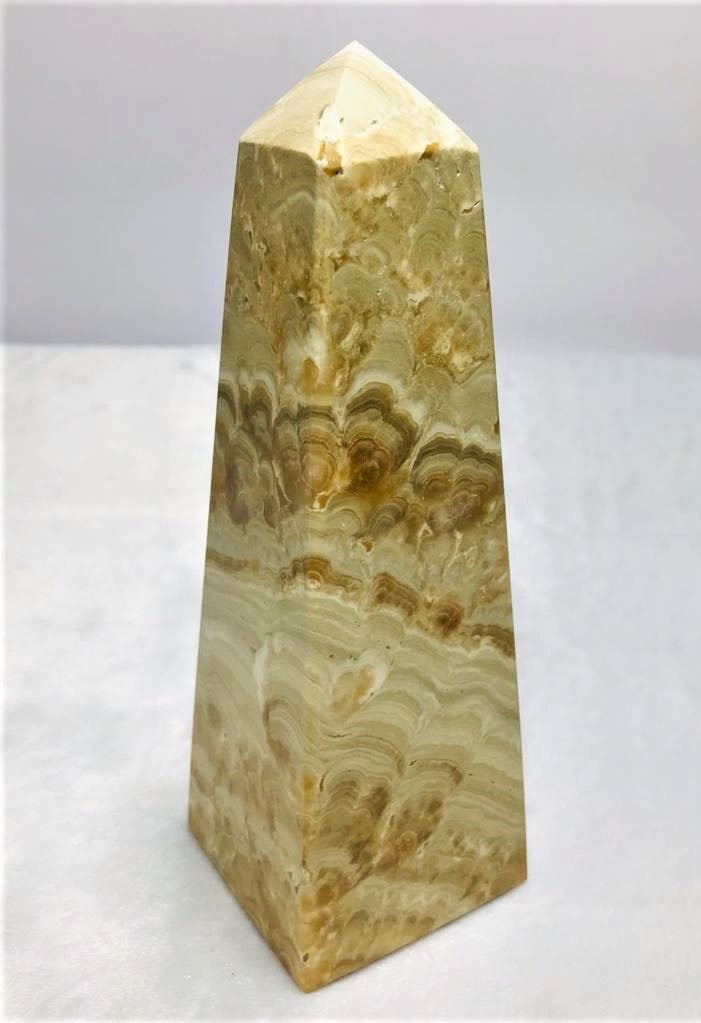 Chocolate Calcite point tower - 621.7 Grams: Chocolate Calcite point tower - 155X51mm - 621.7 Grams Shipping: $60.00. Shipping rates are determined by Parcel weight and destination.