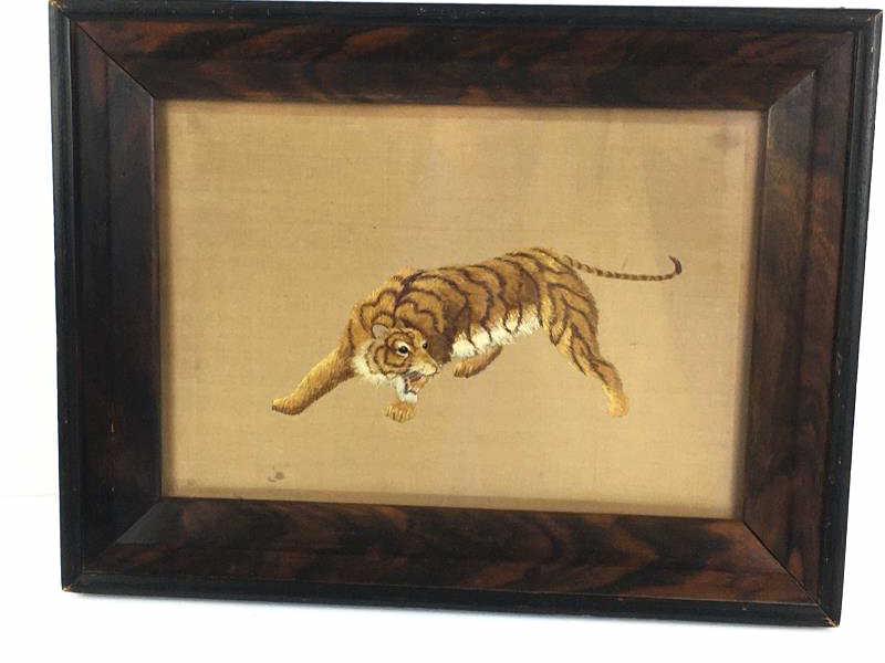 Emboidery of Crouching Tiger: Embroidery of crouching tiger, stained in several spots, wooden frame, under glass, 11 1/2" w x 8" h with 2" frame