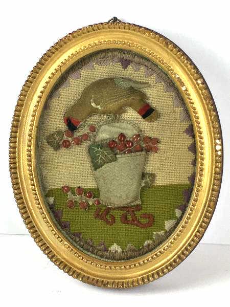 Needlework and Felt Picture: Needlework and Felt Picture of Bird on basket with berries, oval beaded edge frame, damage to edge, 7 1/2" x 9 1/2" with 1 1/4" plaster frame, damaged, Michael Davis, London label on reverse