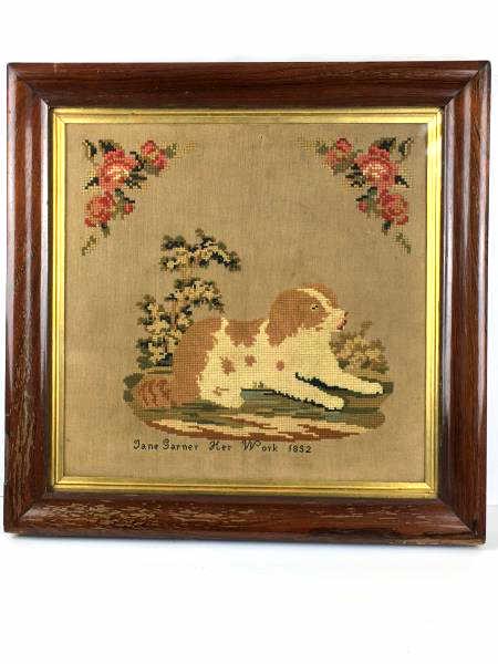 Needlework of Springer Dog: Needlework of Springer Dog, reclining on rug, entitled "Jane Garner Her Work 1852, hole in needlework near center of top, some staining near dog’s head, 16" x 16", 2" frame is worn veneer is peeling