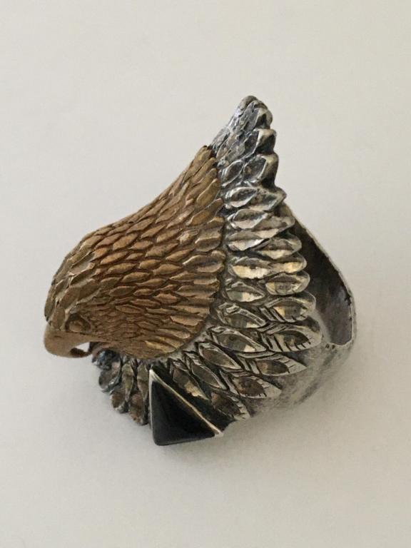 Sterling Eagle Head Ring: two-tone, tested sterling with 2 small black diamond shaped onyx stones, size 9 normal wear and scratches, 14.5 gms