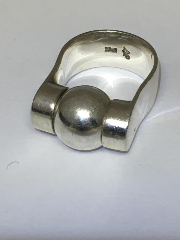 Mid Century Modernist Sterling Ring: marked 925 and maker's mark, center pivoting ball ring is 12mm, tested sterling, size 7 scratched, 13.2 gms