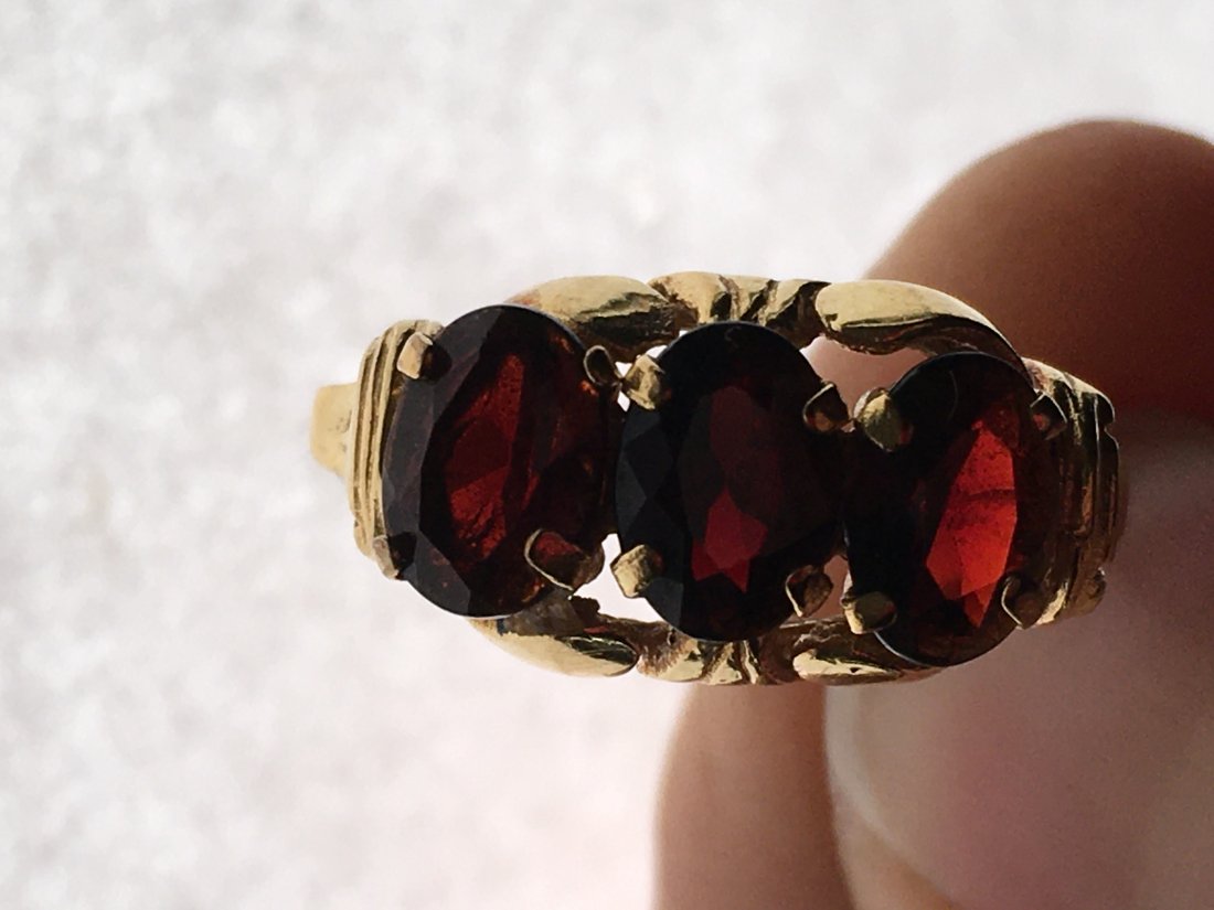 8K YG Vintage 3 Garnet Ring: marked .333 (8K), 3 oval garnets each measures 6.4 x 5 mm, size 9, minor wear to stones, some wear on prongs, band is worn