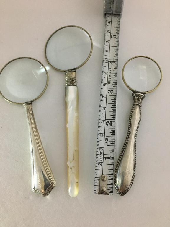 3 Magnifying Glasses, 2 sterling: 1 mother of pearl, 4 1/2" - 5 1/2" l with 1 1/4" - 1 1/2" glass dia. good condition