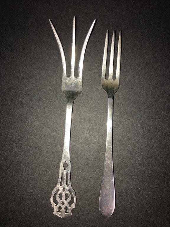 2 Sterling Forks, 1 Tiffany: 1 is RLB Sterling, lemon, pierced, 3 tine, 5" long, Tiffany is 3 tine and 4 3/4" l normal wear and tear, box is fair, 27.9 g