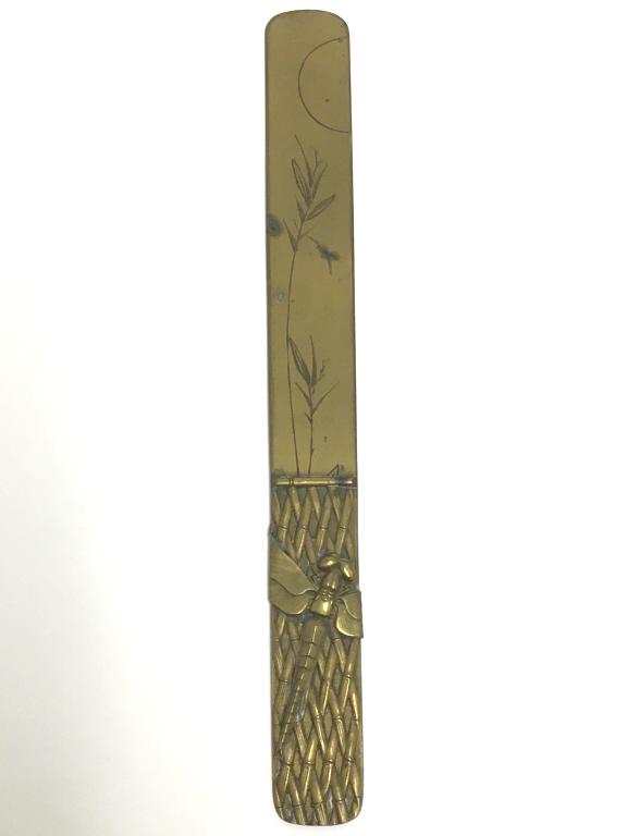 Brass Dragonfly Page Turner: raised dragonfly on bamboo branches, 2 raised dragonflies on the reverse side, 8 1/2" l x 1" w pitting and rust